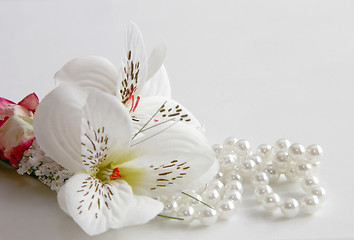 Image showing pearl necklace and silk flowers