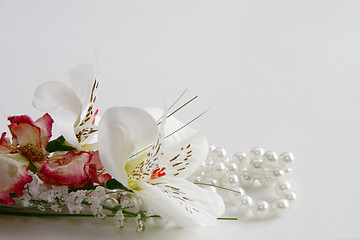 Image showing pearl necklace and silk flowers
