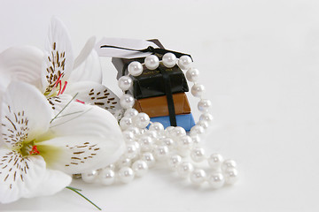 Image showing chocs and flowers with pearls