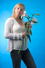 Image showing happy pregnant woman with flower