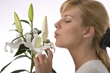 Image showing beautiful girl smelling madonna lily