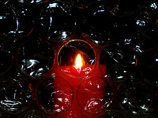 Image showing candle light over bubbles