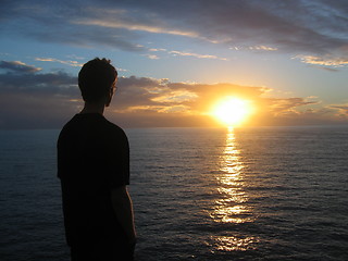 Image showing Man looking at sunset