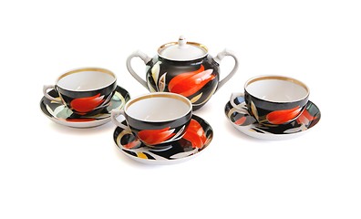 Image showing Black tea service  of three cups and sugar basin isolated 