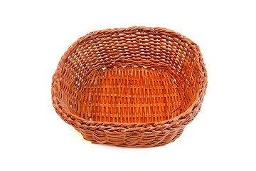 Image showing Empty orange wicker basket isolated 