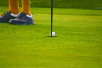 Image showing golf ball on way to the hole