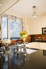 Image showing kitchen in city apartment with skyline views