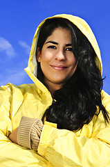 Image showing Beautiful young woman in raincoat