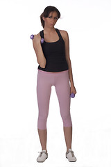 Image showing Woman on white holding purple dumbbells