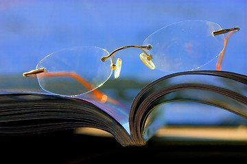 Image showing Glasses on the magazine - Abstract