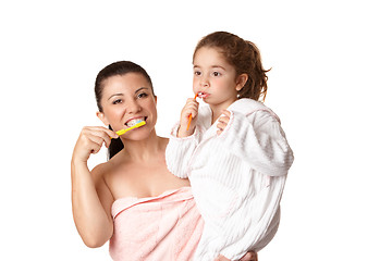 Image showing Mother and daughter brushing teeth