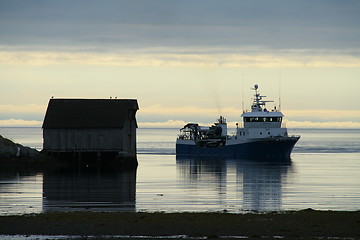 Image showing Fishing boat returns from the sea