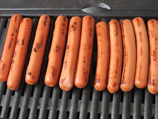 Image showing Barbecue hot dogs on the grill