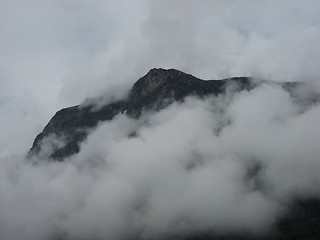 Image showing Mountain top through the clouds