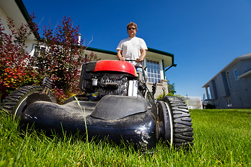 Image showing Mowing the lawn