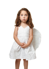 Image showing Little angel child serenely looking to heaven