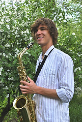 Image showing young man with saxophone