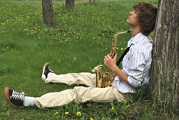 Image showing young man with saxophone