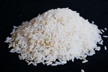 Image showing Pile of rice on black background