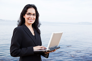 Image showing Hispanic businesswoman with laptop