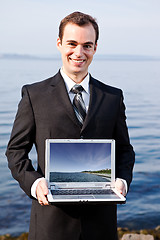 Image showing Caucasian businessman with laptop