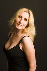 Image showing glamorous woman posing in cocktail dress