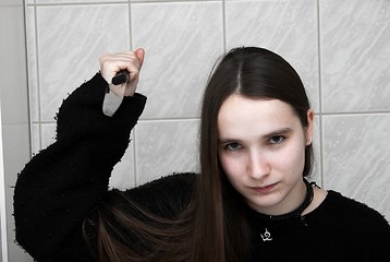 Image showing Girl with knife