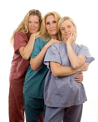 Image showing three nurses in medical scrubs clothes