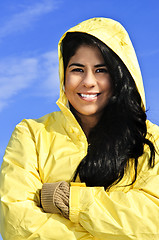 Image showing Beautiful young woman in raincoat