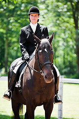 Image showing Horseback riding senior woman