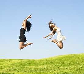 Image showing two jumping woman