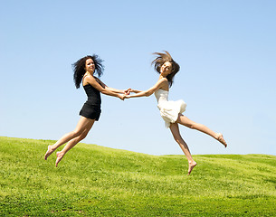 Image showing two jumping woman
