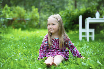 Image showing Smiling little girl outdoors.