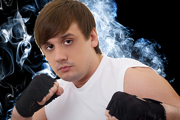 Image showing Portrait of the young fighter in a smoke