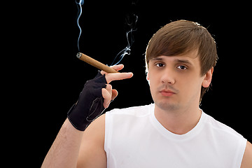 Image showing Portrait of the young man with cigar. Isolated