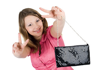 Image showing Beautiful smiling young woman with a handbag. Isolated 