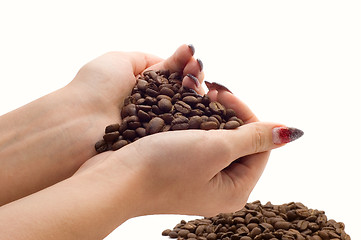 Image showing Female hands and coffee beans