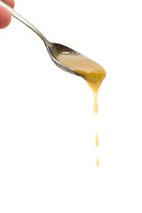 Image showing Honey drip from spoon