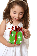 Image showing Little girl with a christmas or other present