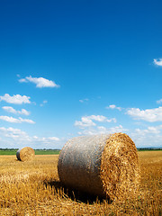 Image showing Countryside landscape with bales of hay