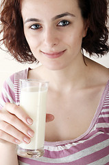 Image showing Young people eating milk with cereals