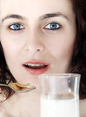 Image showing Young people eating milk with cereals