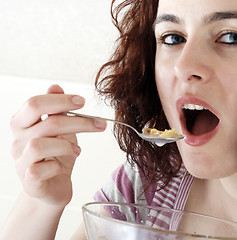 Image showing Young people eating milk with cereals