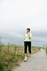 Image showing Sporty running woman