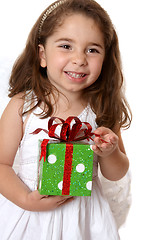 Image showing Angelic girl holding a gift