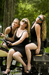 Image showing sexy group blond women on large motorcycle