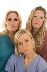 Image showing three nurses medical females with serious expression