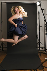 Image showing glamorous woman posing in cocktail dress
