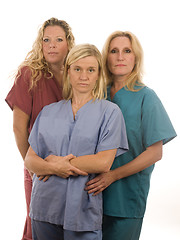 Image showing three nurses in medical scrubs clothes