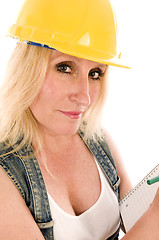 Image showing sexy contractor construction lady writing a contract estimate